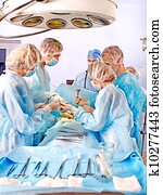 Surgeon at work in operating room. Surgeon at work in operating room.