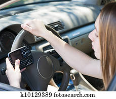 Teenage girl texting and driving