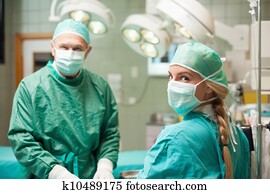 Two surgeon wearing surgical equipment