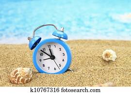 Stock Photograph Of Summer Time Paper Card And Alarm Clock On The Alarm Clock On The Sand