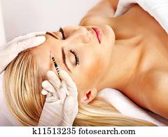 Woman giving botox injections. Woman giving botox injections.