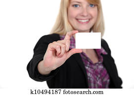 Woman holding up her business card