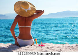 woman resting on the beach woman resting on the beach