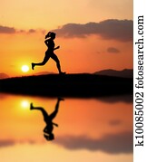 woman running during sunset