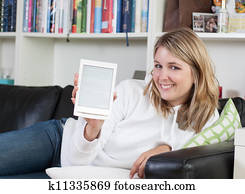 woman shows an ebook reader stock photograph k11335869