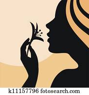 Woman smelling flower- profile Woman smelling flower- profile