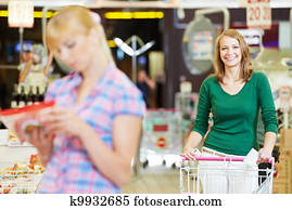 women at supermarket shopping