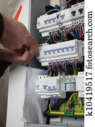 Worker repairing a distribution board