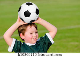 Young boy playing soccer