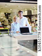 Young couple in consumer electronics store