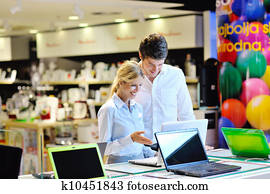 Young couple in consumer electronics store