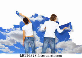 Young couple with paint brushes together