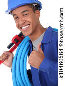 Young plumber with a wrench