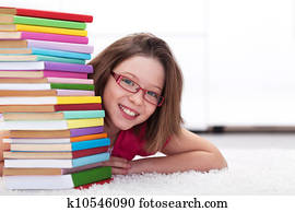 Young student with lots of books smiling Young student with lots of books smiling
