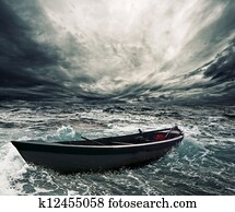 Abandoned boat in stormy sea Abandoned boat in stormy sea