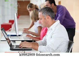 Adult man attending business training Adult man attending business training