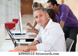 Adult man attending business training Adult man attending business training