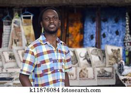 African small business curio salesman selling ethnic items in Howick, Kwa Zulu-Natal South Africa African small business curio salesman selling ethnic items in Howick, Kwa Zulu-Natal South Africa