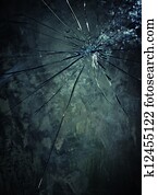 Broken glass over grey background.