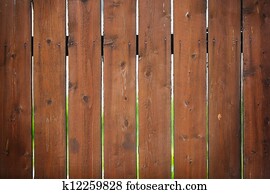 Brown fence with a bright blurred background