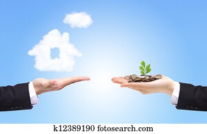 business Hands with money and house