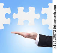 Business man showing puzzle