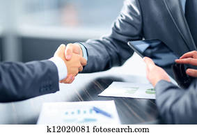 Business people shaking hands in office Business people shaking hands in office