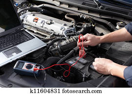 Car mechanic working in auto repair service. Car mechanic working in auto repair service.