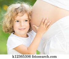 Child listen belly of pregnant woman Child listen belly of pregnant woman