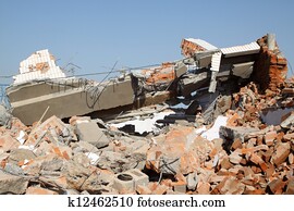 demolition of smoldering rubble 