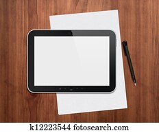 Digital tablet with pen on a desktop
