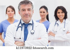 Doctor and his team smiling