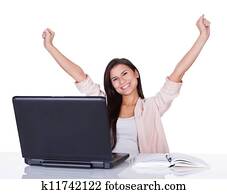 Happy female office worker rejoicing