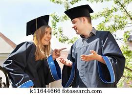 happy graduate students outdoors