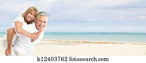 Happy senior couple on the beach.