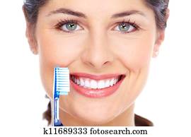 Happy woman with a toothbrush. Dental care.
