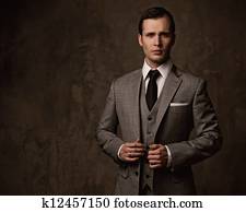 Man in grey suit.