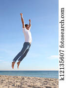 Man jumping happy in the beach