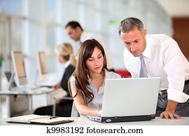 Manager and secretary working in the office