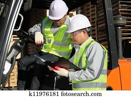 manager talking with forklift operator