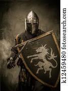 Medieval knight with sword and shield against stone wall Medieval knight with sword and shield against stone wall