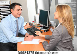 People in the office signing contract