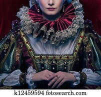 Queen in royal dress and luxuriant collar Queen in royal dress and luxuriant collar
