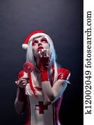 Santa Claus helper woman in red latex outfit