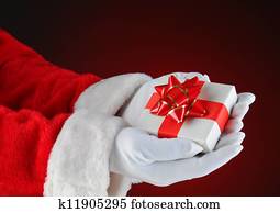 Santa Claus Holding a Small Christmas Present