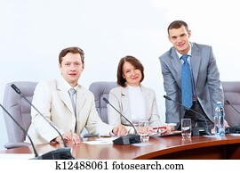 Three businesspeople at meeting