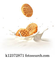 Two cookies biscuits falling into milk splashing. Two cookies biscuits falling into milk splashing.