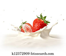 Two strawberries falling into milk splashing. Two strawberries falling into milk splashing.