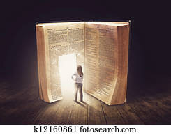Woman looking at large book Woman looking at large book