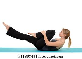 woman Pilates single leg stretch woman Pilates single leg stretch